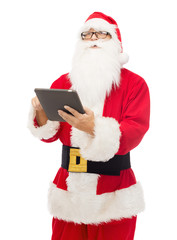 man in costume of santa claus with tablet pc