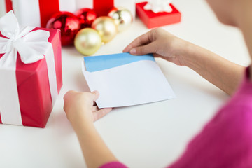 close up of woman with letter and presents