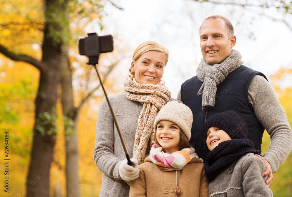 Canvas Prints happy family with smartphone and monopod in park