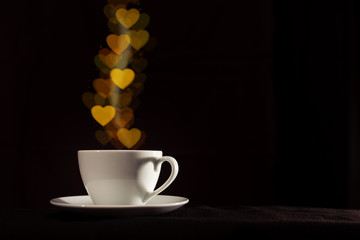 Cup with fantasy golden heart shape steam