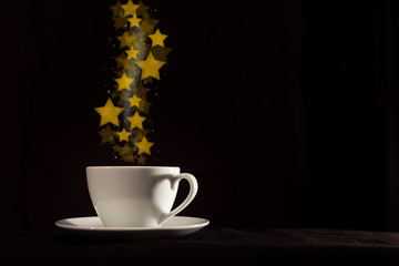 Cup with fantasy golden star shape steam