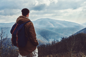 Hiker man looking at the mountains