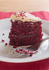 Red velvet cake slice with fork