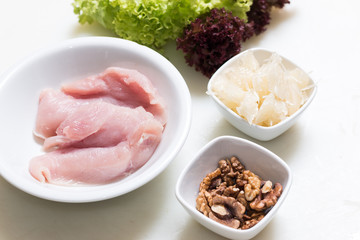 Raw turkey breast, walnut and pomelo