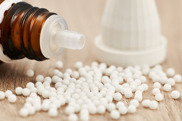 Homeopathic granules scattered on a table