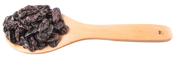 Black raisin on wooden spoon over white background