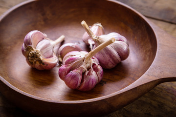 garlic in wooden plate