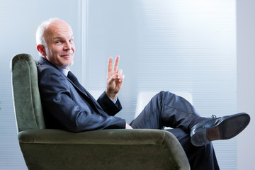 business man with a sly smile wins