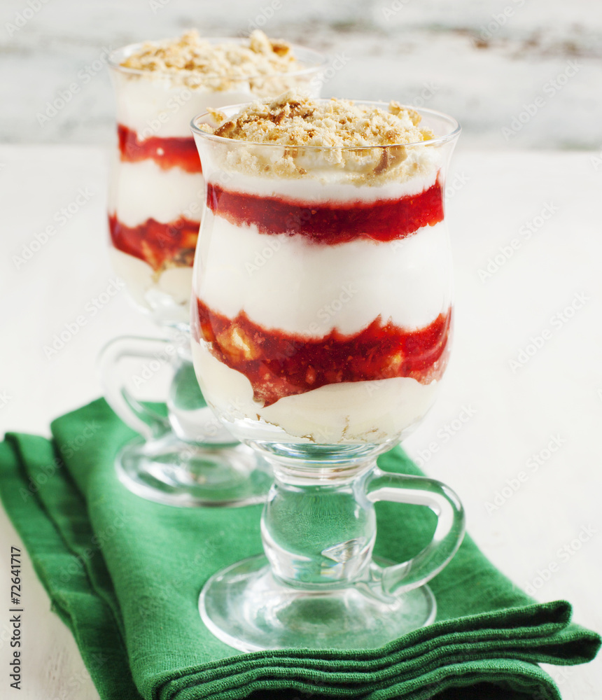 Sticker Layered strawberry dessert with cream.