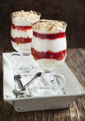 Layered strawberry dessert with cream. Strawberry mousse with cream
