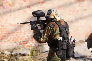 Paintball player holding position