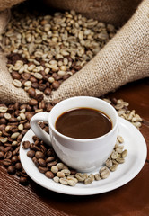 Coffee cup and jute sack full of coffee beans 7
