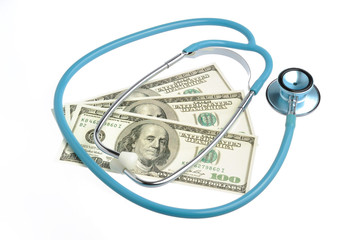 Stethoscope and money isolated on white
