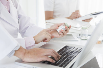Doctors examine the medicine