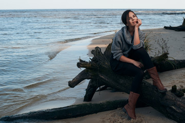 brunette on sea coast in autumn