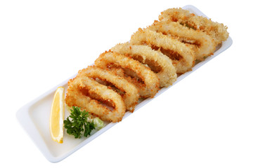 Oven fried onion rings,dipped batter,  in a row.