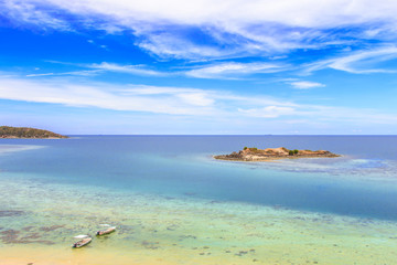 Fototapeta premium Aerial view of crystal clear water on tropical island