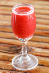 A glass of strawberry smoothie