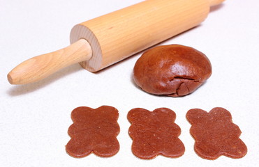 Gingerbread dough for Christmas cookies and rolling pin