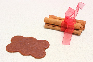 Gingerbread dough for Christmas cookies and cinnamon sticks