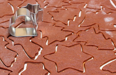 Gingerbread dough for Christmas cookies and cookie cutters