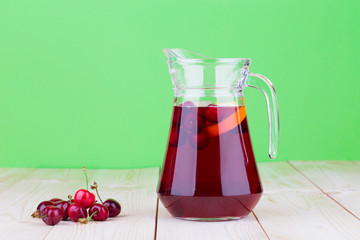 Pitcher with cherries and juice