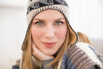 Close up of a woman in winter hat looking at the camera