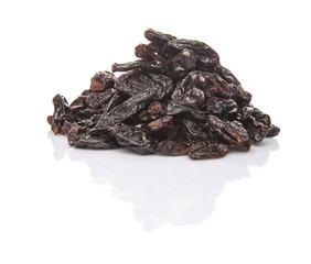 Black raisin over white background