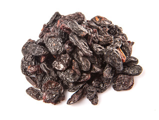 Black raisin over white background