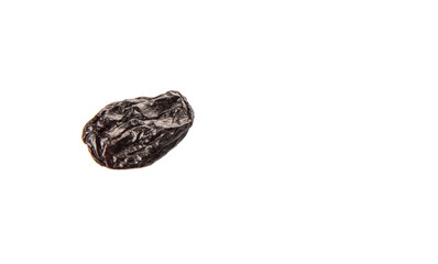 Black raisin over white background 