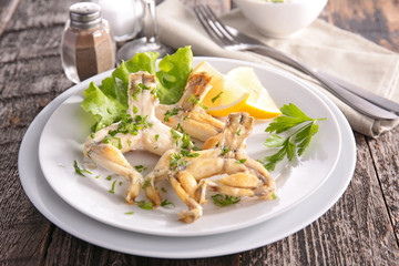 fried frog leg with parsley