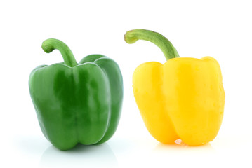 Green and Yellow pepper on white background