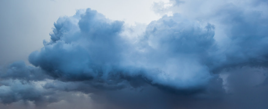 Blue sky with dark and white clouds 