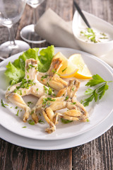 fried frog leg with parsley