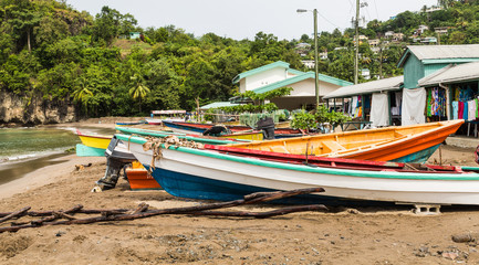Fototapeta premium Colorful Fishing Boats on Beach Behind old Houses