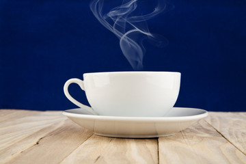 cup of coffee on a dark blue background