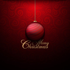 Red Christmas bauble on patterned background