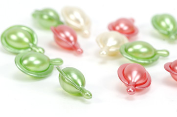 Multi-colored vitamins on white background