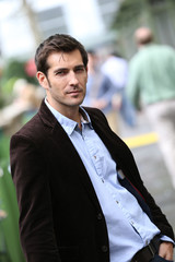 Businessman standing in city steet