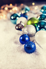 A Lot Of Baubles On Snowy Background