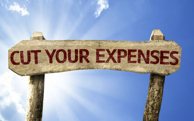Cut Your Expenses sign on a summer day
