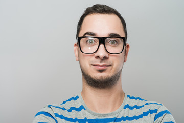 Young cool trendy man with glasses smiling