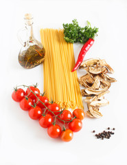 Spaghetti with tomatoes and dry mushrooms on white background