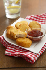Chicken nuggets with tomato sauce
