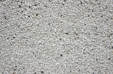 rough wall background with prominent porous patches