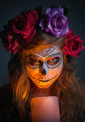 Halloween witch. Beautiful woman wearing santa muerte mask portr