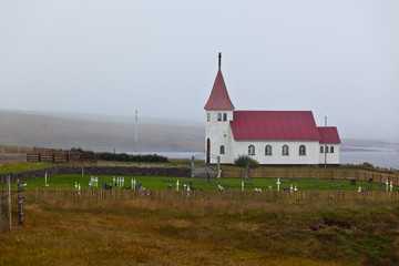 Fototapeta premium Typical Rural Icelandic church with local cemetery
