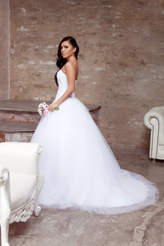 Brunette bride posing in studio