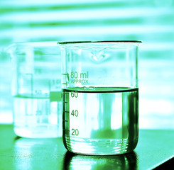 Laboratory research, Beaker containing chemical liquid