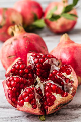Ripe pomegranate fruit on White wooden Background